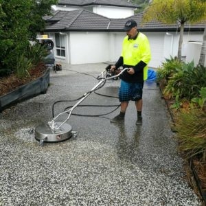 What are the signs that my driveway needs pressure washing?